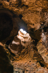 Cueva del indio arecibo rock texture inside the cave with holes and the sunlight 