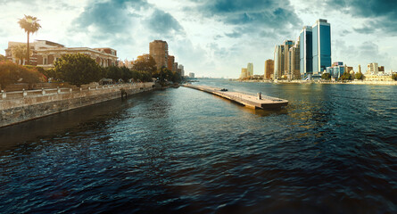 Egypt, Cairo - Panoramic View of Nile River and Modern Skyscrapers, Buildings near Zamalek and Downtown Cairo, Sunset View. - obrazy, fototapety, plakaty