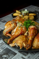 succulent grilled chicken on a newspaper background