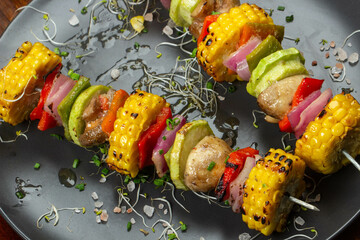 skewers of delicious grilled colorful vegetables