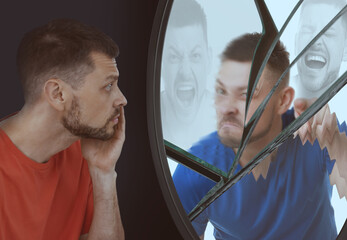 Suffering from hallucinations. Man looking in broken mirror and seeing himself with different...