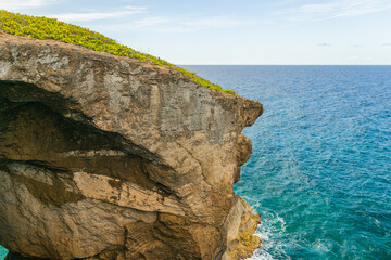Cueva del indio rock cliff formation  landscape around turquoise water in a cloudy day from puerto rico in arecibo
