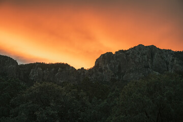 Orange Clouds Hang Over The Ridge In The Chisos Mountains of Big Bend