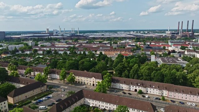 Drone shot of Wolfsburg city , Germany . It's known as the headquarters for Volkswagen and for the Autostadt, an automobile-themed park with a classic-car museum and driving track.