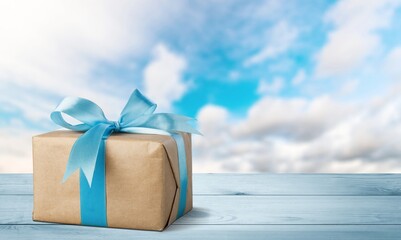 small beautiful gift box with a bow on desk