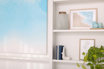 Interior design. Shelves with stylish accessories and books near white wall