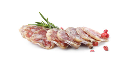 Slices of delicious fuet sausage with rosemary and pepper on white background