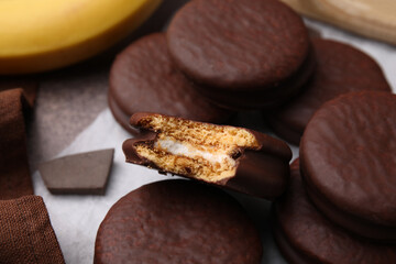 Tasty banana choco pies on table, closeup