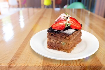 Tasty sweet cake with ripe fresh strawberries.