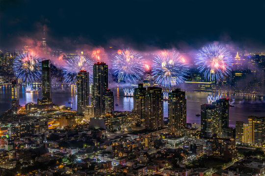 Aerial View of Macy's NYC 4th of July Fireworks NYC Skyline Long Island City buildings purple red