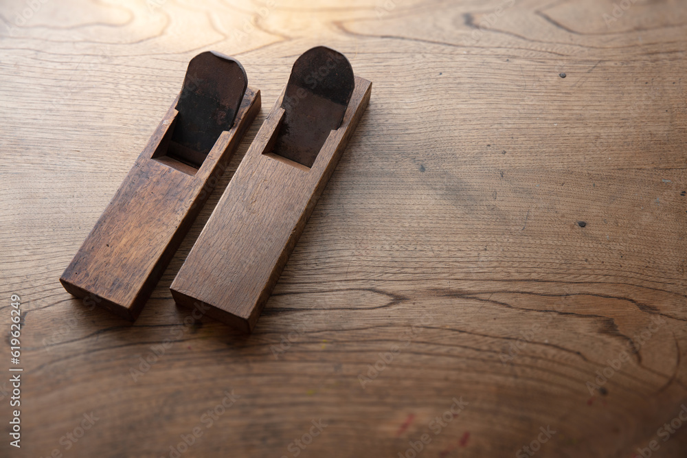 Wall mural two japanese vintage block planes on an old rustic work table. vintage japanese block planes with ha