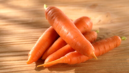 fresh vegetables. carrots on a wooden background. harvest on the table. food preparation. sunny day. 
