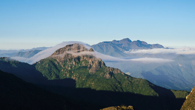 Itaguar&eacute; Peak being covered with clouds on sunrise. Passa Quatro, Minas Gerais, Brazil
