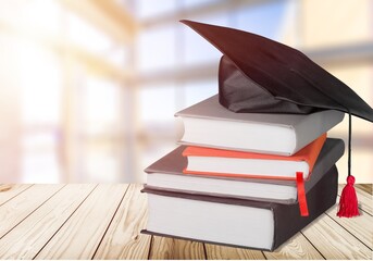 Graduation cap and set of books for education day