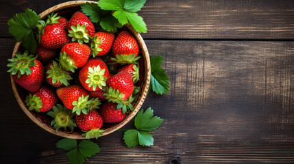 strawberries in a bowl on a small wooden table