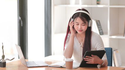 Young Girl Listening to Music in Stylish Headphones, Enjoying Leisure Time