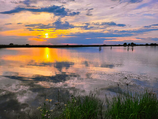 Obraz premium sunset over the river