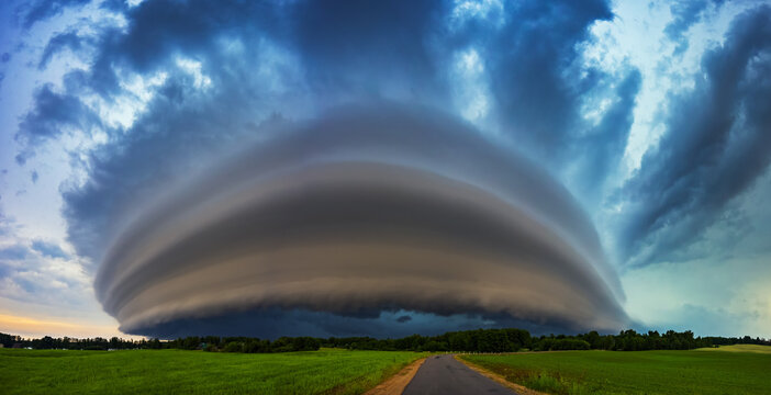 Angry supercell storm influenced by Climate change. Dangerous storm supercell shelf cloud with layers.