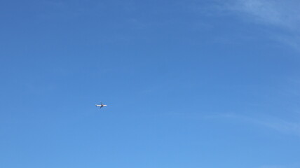 Fototapeta na wymiar Airplane with a blue sky background