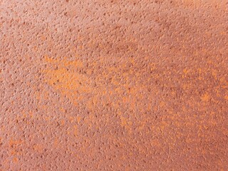 A rough surface and textured background of a rusted metal