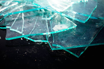 Broken glass pile pieces texture and black background