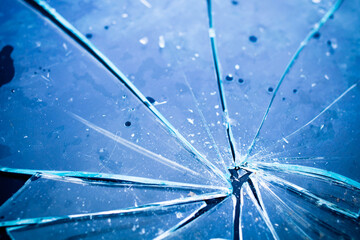 Texture of broken glass in blue light