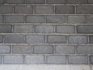 Fototapeta premium Unfinished concrete block wall background and texture.
