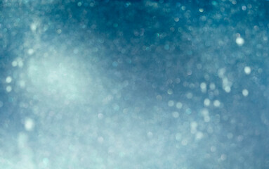 Defocused abstract blue and white bokeh lights