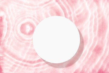 White empty round podium on a pink water