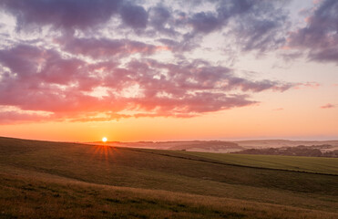 Fototapeta na wymiar July sunset over the south downs from Falmer Road Brighton East Sussex south east England UK
