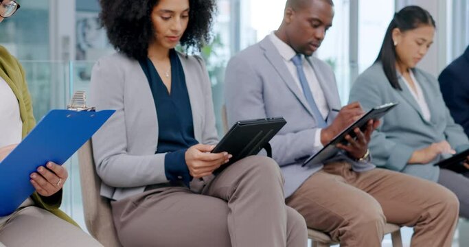 Application paperwork, job interview and people in waiting room with online resume at recruitment agency. Human resources, men and women in writing survey, report or information for hiring in lobby.