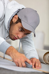 portrait of a handyman working on flooring