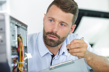 Fototapeta na wymiar male worker fixing a machine