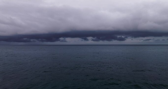 Storm clouds and rain over sea, Dark storm clouds passing video,High quality footage clouds over sea and waves background