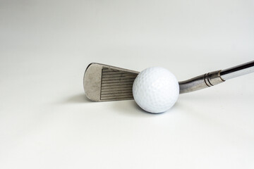 Golf club and ball isolated on white background. 