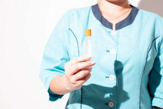 Doctor  holding test tubes . Portrait of doctor on white background, medical photo. Tubes for analysis