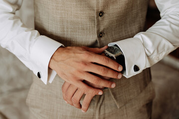 Businessman in Elegant Costume Checking Time Watch Closeup Photo. Young Man Groom Wearing Fashionable Suit Check Hour. Guy Businessperson in Attractive and Stylish Clothes with Crossed Hands
