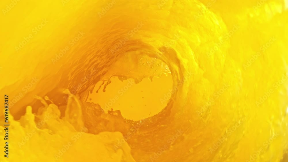 Poster super slow motion of orange juice wave. orange juice surf wave rotating around in creating tunnel sh