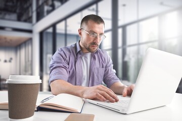 Fototapeta premium Cheerful male professional work on laptop