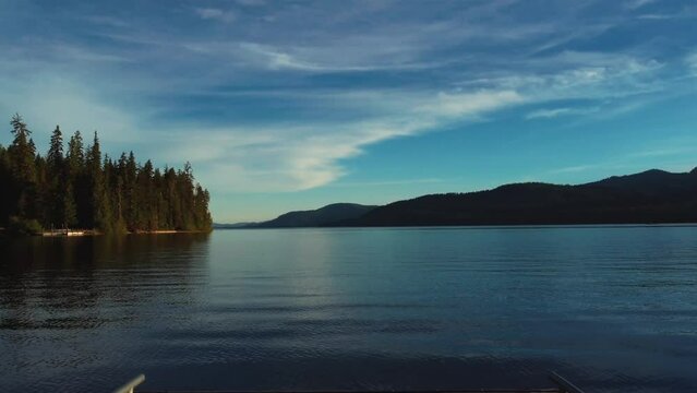 Wooden Dock On Pristine Waters Of Priest Lake In Bonner County, Idaho. wide drone shot