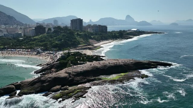 Aerial view of Diabo beach and Ipanema beach, Pedra do Arpoador. People sunbathing and playing on the beach, sea sports. Rio de Janeiro. Brazil