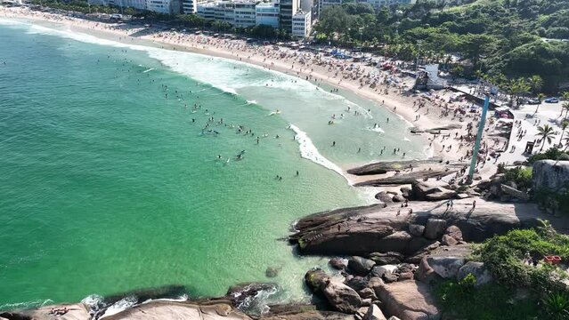 Aerial view of Diabo beach and Ipanema beach, Pedra do Arpoador. People sunbathing and playing on the beach, sea sports. Rio de Janeiro. Brazil