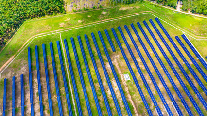 Aerial view over Solar cells energy farm in countryside landscape. Solar panels in aerial view,...