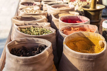 Fototapeta premium Bags of mixed spices in the street market. Colorful detail of Central Asia travel. Bukhara, Uzbekistan