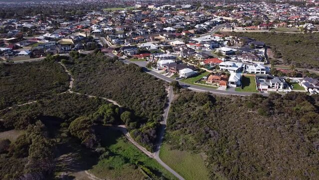Tilt Down View Showing Houses Surrounding Nature Reserve And Old Quinns Rocks Caravan Park Site