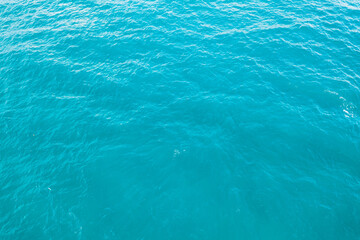 blue ocean waves background. Water surface on ocean. copy space area for text. Reflection on the surface of the ocean on a calm day.