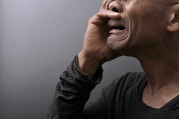 man praying to god with prayer with devotion Caribbean man praying on black background with people stock photos stock photo	