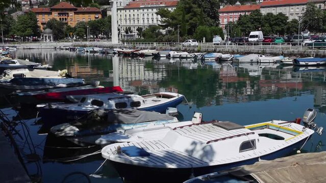 hd 1080 steadicam:  city of rijeka, croatia, boats anchored at city harbor
