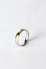 silver and gold wedding ring isolated on white background