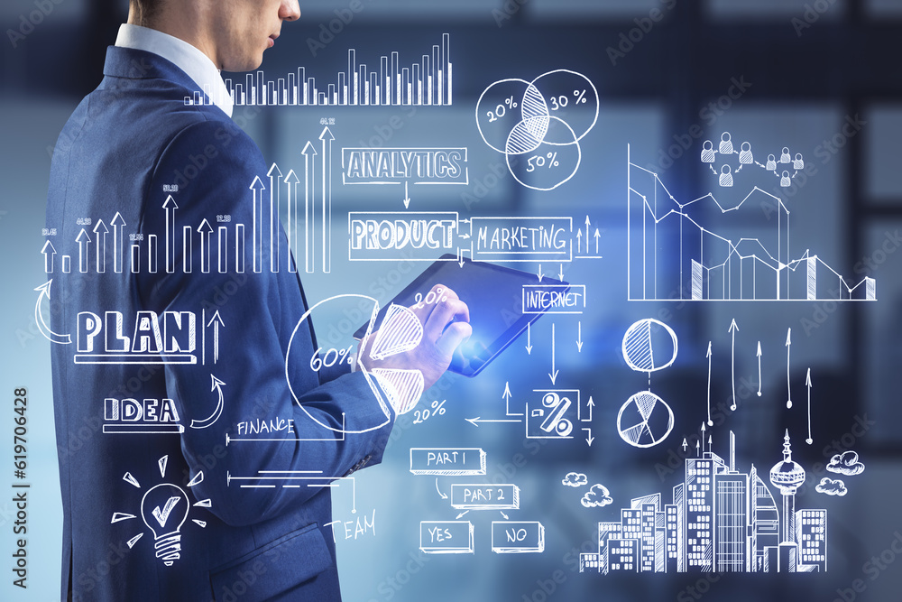 Poster close up of businessman hands using tablet with creative toned business sketch on blurry office inte
